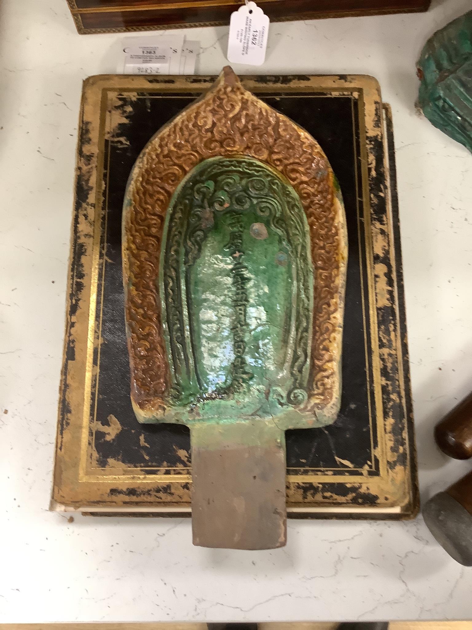 A pair of Chinese sancai glazed Buddha figures on shrines. 43cm tall